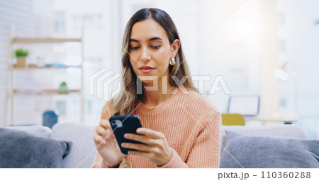 Woman, phone and home on living room sofa with reading, texting or typing for email, contact or web blog. Girl, smartphone and check notification for update, news or social media app on lounge couch 110360288