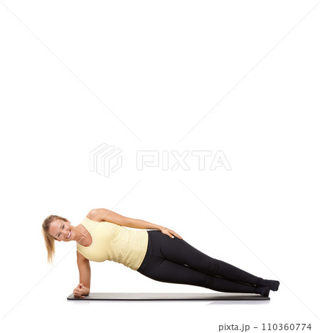Woman, yoga and mat in studio with side plank, fitness or workout for healthy body, happy or core muscle. Person, portrait and pilates on floor for abdomen health on mockup space or white background 110360774