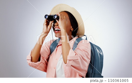 Woman, binoculars and search on adventure, studio and travel or backpack by gray background. Black person, vacation and holiday in mockup, watch and explore on journey, gear and equipment for tourist Woman, binoculars and search on adventure, studio and travel or backpack by gray background. Black person, vacation and holiday in mockup, watch and explore on journey, gear and equipment for tourist 110361005