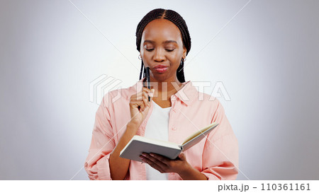 Woman, notebook and thinking of ideas, learning and studying with solution or goals on a white background. African student problem solving, reading notes and why face, confused or planning in studio 110361161