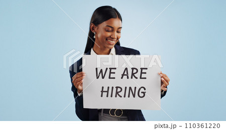 Happy business woman, hiring and sign for advertising or opportunity deal against a blue studio background. Female person smile with billboard or poster for job recruiting or career on mockup space Happy business woman, hiring and sign for advertising or opportunity deal against a blue studio background. Female person smile with billboard or poster for job recruiting or career on mockup space 110361220