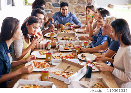 Whats better than pizza with friends. a group of friends enjoying pizza together. 110361335