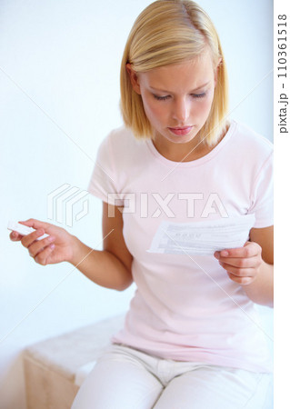 Reading, instructions and woman with pregnancy test in bathroom waiting for results, news and information. Motherhood, pregnant and person with medical testing kit for fertility or ovulation at home Reading, instructions and woman with pregnancy test in bathroom waiting for results, news and information. Motherhood, pregnant and person with medical testing kit for fertility or ovulation at home 110361518