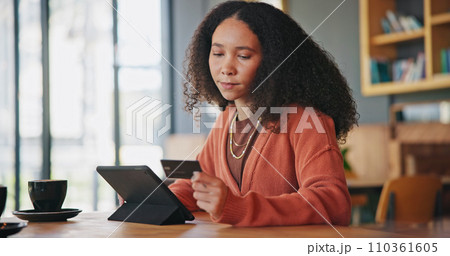 Tablet, credit card and woman in cafe, online shopping and payment in coffee store. Technology, plastic money and African person in restaurant in ecommerce, fintech or typing on financial banking app 110361605