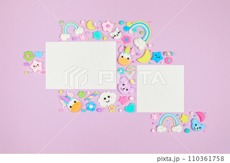 Two blank white cards on pastel purple background with kawaii cartoon animals Two blank white cards on pastel purple background with kawaii cartoon animals 110361758