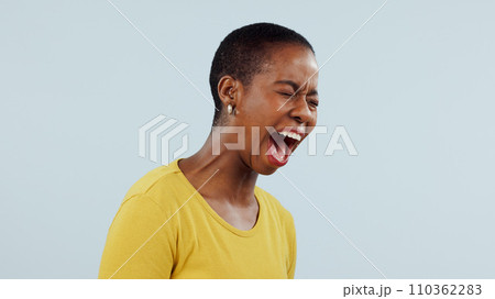 Stress, anxiety and angry black woman screaming in studio with broken heart, grief or fear on grey background. Psychology, depression and African female model shouting with trauma, conflict or crisis 110362283