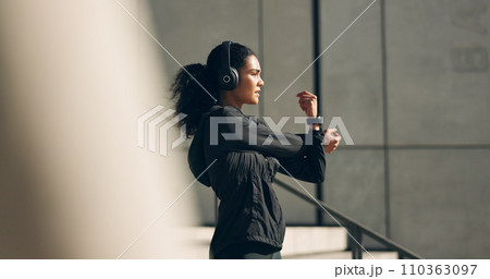 Runner woman, headphones and warm up on stairs for music, vision and ideas in city, workout and training. Girl, thinking and listen on steps with streaming subscription, wellness and stretching arms Runner woman, headphones and warm up on stairs for music, vision and ideas in city, workout and training. Girl, thinking and listen on steps with streaming subscription, wellness and stretching arms 110363097