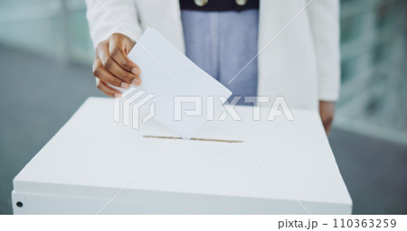 Hand, ballot and box for vote paper at president election cast, poll station choice or government selection. Person, fingers and decision document or politics support or usa process, opinion at booth Hand, ballot and box for vote paper at president election cast, poll station choice or government selection. Person, fingers and decision document or politics support or usa process, opinion at booth 110363259