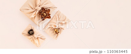 Furoshiki gifts wrapping. Presents wrapped by cloth . 110363445