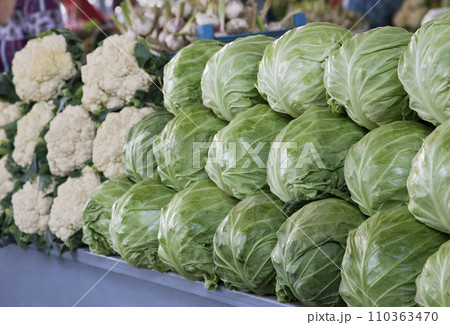Fresh cabbages and cauliflower at a market Fresh cabbages and cauliflower at a market 110363470