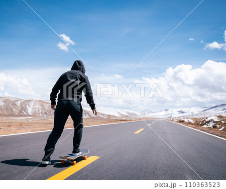 Skateboarder going to hit the road Skateboarder going to hit the road 110363523