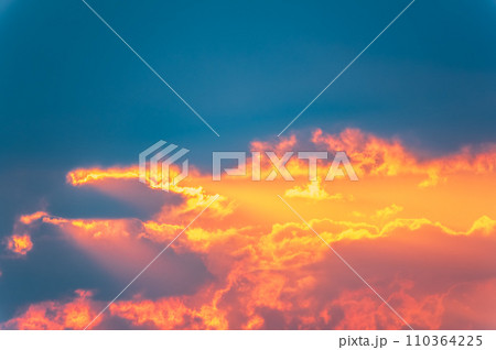 Dramatic cloudy sky background. Orange cloudy sunset sky. Dramatic cloudy sky background. Orange cloudy sunset sky. 110364225