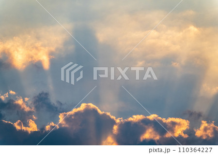 Dramatic cloudy sky background. Orange cloudy sunset sky. Dramatic cloudy sky background. Orange cloudy sunset sky. 110364227