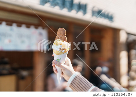 Woman showing Daibutsu or Buddha yogurt crepe, popular dessert in Kamakura, Kanakawa, Japan 110364507