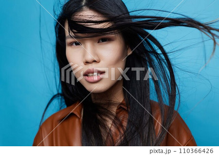 Happy woman cute smile long girl beauty studio asian hair background attractive trendy portrait blue lifestyle Happy woman cute smile long girl beauty studio asian hair background attractive trendy portrait blue lifestyle 110366426