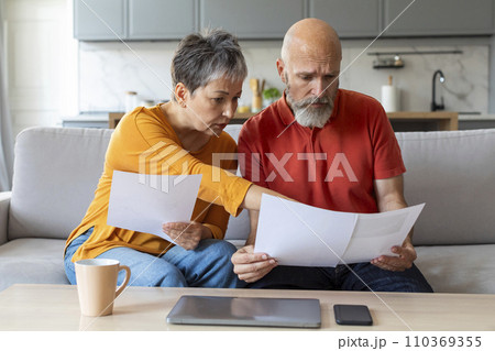 Budget Planning. Worried Senior Spouses Holding Papers And Calculating Family Spends Together 110369355