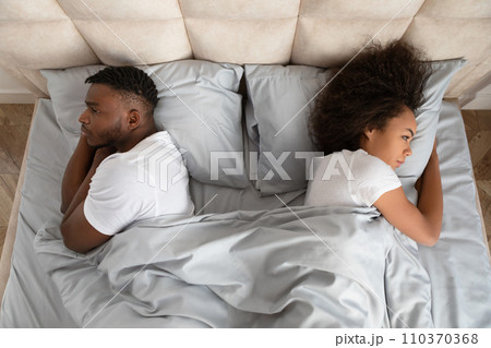 Black Couple Turning Backs To Each Other Lying In Bed Black Couple Turning Backs To Each Other Lying In Bed 110370368