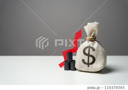 Oil barrels and dollar money bag and red arrow up. Trade and growth of transportation of oil. Rising profit from the sale of energy resources and petroleum products. Positive prognosis 110370565