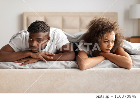 Black Man And Woman Looking Away Sulking Lying In Bed 110370948