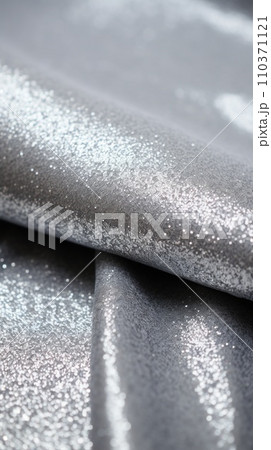 Glitter bokeh of satin fabric for background. Textile close up rippled elegant 110371121
