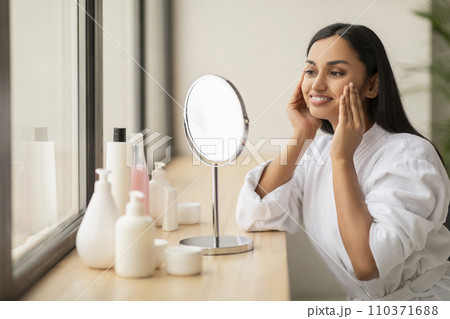 Portrait Of Attractive Happy Woman Looking At Mirror In Bathroom 110371688