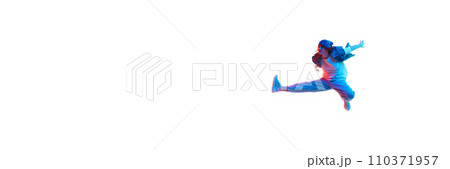 Young girl, hip hop dancer in motion, dancing isolated over white background in neon light 110371957