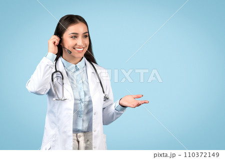 Woman doctor with headset ready for teleconsultation 110372149