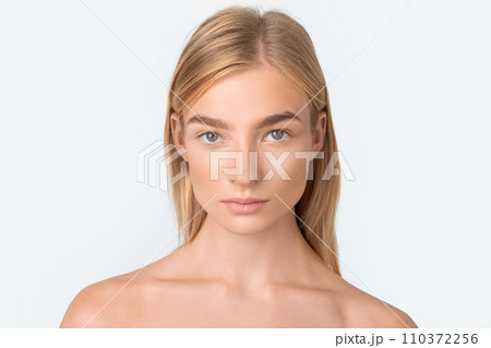 blonde woman with beautiful skin posing shirtless over white wall blonde woman with beautiful skin posing shirtless over white wall 110372256