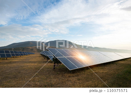 Solar power station. Solar panels, photovoltaics, alternative source of electricity - concept of sustainable and renewable sources. Solar power station. Solar panels, photovoltaics, alternative source of electricity - concept of sustainable and renewable sources. 110375571