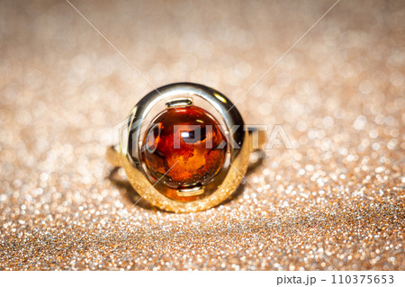 Golden ring with red amber Golden ring with red amber 110375653