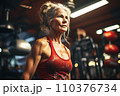 Portrait of athletic gray hair woman working out in gym . Fitness and bodybuilding concept 110376734