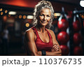 Portrait of athletic gray hair woman working out in gym . Fitness and bodybuilding concept 110376735