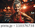 Portrait of athletic gray hair woman working out in gym . Fitness and bodybuilding concept 110376738