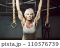 Portrait of athletic gray hair woman working out in gym . Fitness and bodybuilding concept 110376739