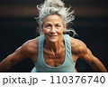 Portrait of athletic gray hair woman working out in gym . Fitness and bodybuilding concept 110376740
