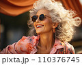 Portrait of beautiful smiling mature woman with long gray hair wearing sunglasses 110376745