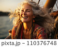 Portrait of beautiful smiling mature woman with long gray hair 110376748