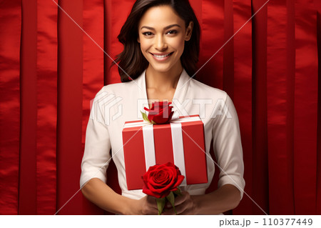 A gorgeous woman in white with gift and rose valentine red background, Valentines day discount promotion advertisement. Generative AI A gorgeous woman in white with gift and rose valentine red background, Valentines day discount promotion advertisement. Generative AI 110377449