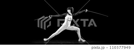 Banner. Striking profile of two-sword-wielding sportswoman, radiating power and grace against black studio background with copy space for text. Banner. Striking profile of two-sword-wielding sportswoman, radiating power and grace against black studio background with copy space for text. 110377949