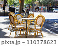 Sunny Cafe terrace in Barcelona, empty table with chairs outside in the street 110378623
