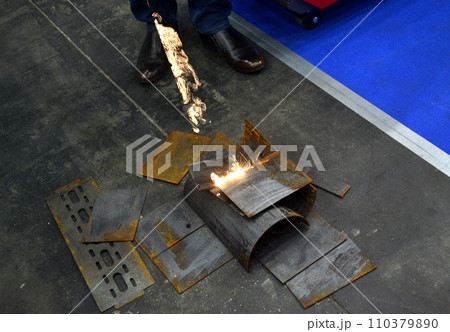 Laser metal cleaning. Metal cleaning with laser from rust. New modern innovative technologies. Metal laser cleaning with portable equipment. Cleansing laser. Highly concentrated powerful radiation. 110379890
