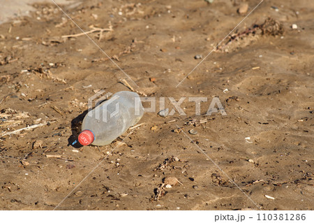 plastic trash on the beach 110381286