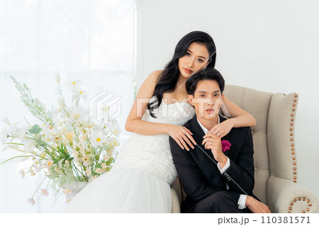 Groom and bride together, exuding elegance and joy in a bright wedding portrait setting - Pre wedding posed for photography 110381571