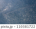 broken tempered glass in cracks, spoiled glass surface texture, close-up. 110381722