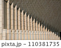 facade of the building with stone wall decoration, geometric shapes in the design of the architectural style. 110381735