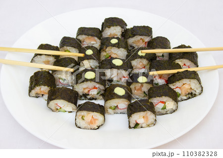 Japanese cuisine, rice sushi and fish - closeup Japanese cuisine, rice sushi and fish - closeup 110382328