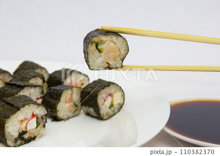 Japanese cuisine, rice sushi and fish - closeup Japanese cuisine, rice sushi and fish - closeup 110382370