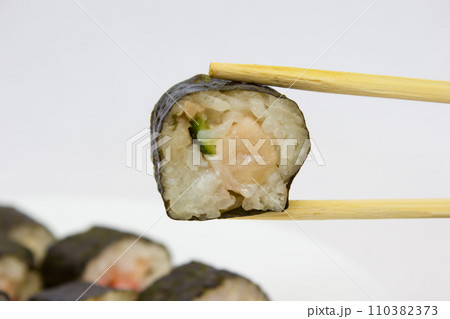 Japanese cuisine, rice sushi and fish - closeup Japanese cuisine, rice sushi and fish - closeup 110382373