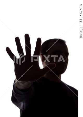 Hand young man covers his face, protest - silhouette, concept Hand young man covers his face, protest - silhouette, concept 110382413