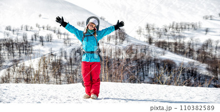 Young woman on the snowboard Young woman on the snowboard 110382589